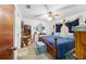 Comfortable bedroom featuring a ceiling fan and classic furnishings at 17128 Se 140Th Ave, Weirsdale, FL 32195