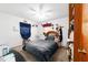 Bedroom with a bed, ceiling fan, desk, and decorations at 17128 Se 140Th Ave, Weirsdale, FL 32195