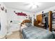 Cozy bedroom with carpet, a closet, and traditional furnishings at 17128 Se 140Th Ave, Weirsdale, FL 32195