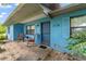 Close-up of a front porch, showcasing rocking chairs and a welcoming entrance at 17128 Se 140Th Ave, Weirsdale, FL 32195