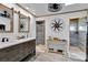 Charming bathroom with double vanity, wood-look floors, shiplap walls, and rustic accents at 2922 Cocovia Way, Leesburg, FL 34748