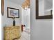 Entryway with a decorative chest and a view into another room at 2922 Cocovia Way, Leesburg, FL 34748