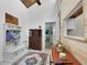 Inviting hallway with rustic wood accents, built-in storage, and charming decor at 2922 Cocovia Way, Leesburg, FL 34748