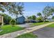 Charming single-Gathering home with manicured front yard and mature trees at 2922 Cocovia Way, Leesburg, FL 34748