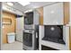 Laundry room equipped with modern washer and dryer, plus a convenient dog washing station at 2922 Cocovia Way, Leesburg, FL 34748