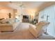 Bright and spacious living room with comfortable seating and neutral carpeting at 3021 Beard Rd, The Villages, FL 32163