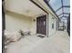 Comfortable screened-in porch featuring a ceiling fan and seating area at 3021 Beard Rd, The Villages, FL 32163