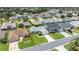 An aerial view showcases manicured lawns at 3024 Burbank Ln, The Villages, FL 32162