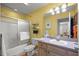 Well-lit bathroom featuring a shower and vanity, offering a comfortable and functional space at 3024 Burbank Ln, The Villages, FL 32162