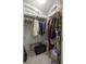 Walk-in closet with storage and clothing at 3024 Burbank Ln, The Villages, FL 32162