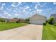 Well-maintained home with a spacious driveway, lush green lawn and mature landscaping at 3024 Burbank Ln, The Villages, FL 32162
