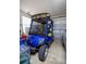 Garage showcasing a Yamaha golf cart at 3024 Burbank Ln, The Villages, FL 32162