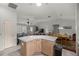 Open concept kitchen with light colored counters and cabinetry at 3024 Burbank Ln, The Villages, FL 32162