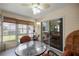 Screened lanai featuring comfortable seating and ceiling fan at 3024 Burbank Ln, The Villages, FL 32162