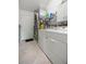 The laundry room includes a washer, dryer, and storage space for added convenience at 3024 Burbank Ln, The Villages, FL 32162
