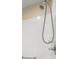 Close-up of a clean shower with white tiled walls and modern fixtures at 3024 Burbank Ln, The Villages, FL 32162