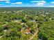 Broad aerial shot showing an arrow-marked home site surrounded by trees and indicating the area's peaceful seclusion at 3445 Se 139Th Ln, Summerfield, FL 34491