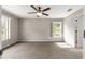 A cozy bedroom offering carpeted floors, neutral walls, and a modern ceiling fan at 3445 Se 139Th Ln, Summerfield, FL 34491