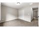 Bedroom featuring carpet flooring, double-door closet, and natural light at 3445 Se 139Th Ln, Summerfield, FL 34491