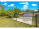 Lovely home showcasing a spacious driveway, attached garage, and a beautiful green lawn at 3445 Se 139Th Ln, Summerfield, FL 34491