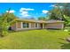 Charming single-story home with a well-manicured lawn and traditional curb appeal at 3445 Se 139Th Ln, Summerfield, FL 34491