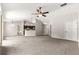 Expansive living room with vaulted ceilings, neutral paint and open floorplan to kitchen at 3445 Se 139Th Ln, Summerfield, FL 34491