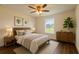 Serene bedroom with natural light, hardwood floors, and soothing decor at 3529 Sw 150Th Ct, Dunnellon, FL 34432