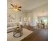 Bright, open living space with hardwood floors, ceiling fan, and a dining area with views at 3529 Sw 150Th Ct, Dunnellon, FL 34432