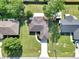 Aerial view of home with mature landscaping, large backyard, and a long driveway at 4085 Ne 17Th Ave, Ocala, FL 34479