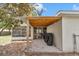 The cozy covered back patio is perfect for outdoor cooking with a grill and entertainment at 4085 Ne 17Th Ave, Ocala, FL 34479