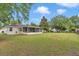 Spacious backyard featuring a screened lanai and plenty of room for outdoor activities at 4085 Ne 17Th Ave, Ocala, FL 34479