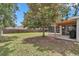 Expansive backyard featuring a screened-in patio and a pergola-covered grill area at 4085 Ne 17Th Ave, Ocala, FL 34479