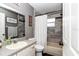 This bathroom boasts a tub-shower combination and updated gray-tone marble-patterned tile surround at 4085 Ne 17Th Ave, Ocala, FL 34479