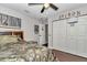 Spacious bedroom features wood-look tile flooring, camouflage decor, and ample storage at 4085 Ne 17Th Ave, Ocala, FL 34479