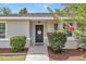 Inviting home entrance, featuring mature landscaping, and welcoming front door decor at 4085 Ne 17Th Ave, Ocala, FL 34479