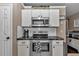 Modern kitchen with stainless steel appliances, white cabinets and subway tile backsplash at 4085 Ne 17Th Ave, Ocala, FL 34479