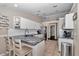 Bright kitchen with island seating, white cabinets, stainless steel appliances, and tile flooring at 4085 Ne 17Th Ave, Ocala, FL 34479
