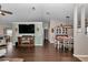 Open floor plan living room and dining area featuring dark wood floors and modern decor at 4085 Ne 17Th Ave, Ocala, FL 34479