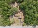 Aerial view shows the house surrounded by trees and the property boundaries at 4467 Sw Channel Heights Ct, Dunnellon, FL 34431