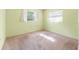 Bedroom featuring pastel green walls, carpet, and windows with blinds at 4467 Sw Channel Heights Ct, Dunnellon, FL 34431