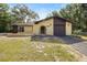 Charming one-story home featuring a stucco exterior, arched entryway, and a one-car garage at 4467 Sw Channel Heights Ct, Dunnellon, FL 34431
