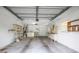 Garage with white walls, shelves, a window, and hookups for a washer and dryer at 4467 Sw Channel Heights Ct, Dunnellon, FL 34431