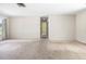 Living room featuring neutral walls, carpet, and entryways to other rooms at 4467 Sw Channel Heights Ct, Dunnellon, FL 34431