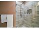 Beautiful glass enclosed shower featuring gray and white brick style tiles and a built in soap niche at 4673 Se 115Th St, Belleview, FL 34420
