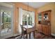 Cozy dining area features natural light and a classic wooden hutch at 4673 Se 115Th St, Belleview, FL 34420
