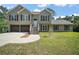 Charming home boasts classic siding, double garage, and well-maintained front lawn at 4673 Se 115Th St, Belleview, FL 34420