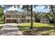 Well-kept home with manicured lawn and a convenient storage shed on a large lot at 4673 Se 115Th St, Belleview, FL 34420