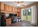 Bright home office with built-in cabinets, hardwood floors, and a large window offering scenic outdoor views at 4673 Se 115Th St, Belleview, FL 34420