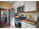 Kitchen features stainless appliances and granite countertops at 4673 Se 115Th St, Belleview, FL 34420