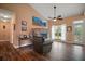 Inviting living room features a stone fireplace, vaulted ceiling, and wood floors at 4673 Se 115Th St, Belleview, FL 34420